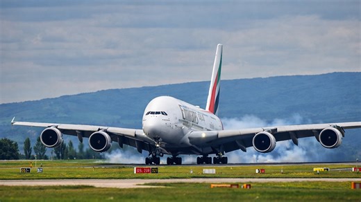 Massive A380 landing with visible tire smoke
