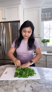 Have you ever brought home fresh herbs with the best of intentions only to dig them out of the fridge later and find that they’ve turned slimy and unusable? Such a waste and so frustrating especially when you are about to make a recipe. Here’s how I keep my cilantro fresh & fragrant so it’s ready when I need it. #ministryofcurry #mealprep #cilantro More tips on storing cilantro: https://ministryofcurry.com/fresh-cilantro/ | Ministry of Curry
