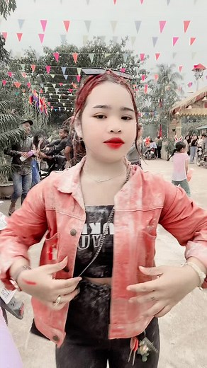 Vibrant Outdoor Dance Performance with Hand Gestures