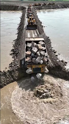 Massive Bulldozers & Dump Trucks Building a Rock Road Across Water 1