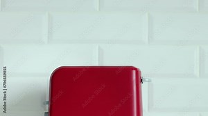 Roasted toast bread popping up from bright red toaster machine. Two toast pieces popping out from toaster