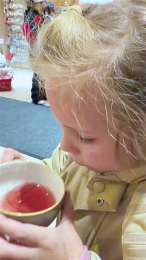 Little Naomi & David eating warm Finnish salmon soup with rosy cheeks after playing in the snow