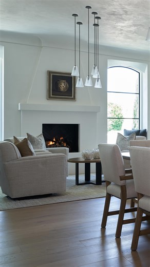 A formal dining room, wine storage, bar, and a cocktail seating area arranged around a fireplace—ideal for entertaining in a comfortable refined setting. It’s the kind of space where evenings unfold effortlessly, with laughter, clinking glasses, and the warmth of timeless conviviality. ⁠ Discover more timeless homes, estates, and legacy residences ➡️ @UDALtd⁠ ⁠ Architecture: UDA Ltd.⁠ ⁠Interior Design: @therefinedgroup ⁠ Photographer: @isaacbaileyphoto⁠ Builder: Dan Madison & Co⁠ ⁠ .⁠ ⁠ .⁠ ⁠ .⁠ 
