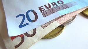 Hands handling money banknotes and coins. Counting money