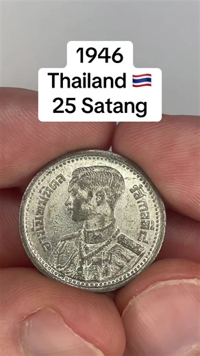 This is an old 1946 25 Satang coin from Thailand made out of Tin. The front of the coin shows a “Bust of King Ananda Mahidol facing left. Script: Thai Lettering: อานันทมหิดล รัชกาลที่ ๘ Translation: Ananda Mahidol. Rama VIII” (Numista). The back shows the “National emblem of Thailand, depicting Garuda front-facing, spreading wings. Script: Thai Lettering: รัฐบาลไทย ๒๕ สต. พ.ศ.๒๔๘๙ Translation: Government of Thailand. 25 Satang. B.E. 2489” (Numista). If you want to see a coin from your country or