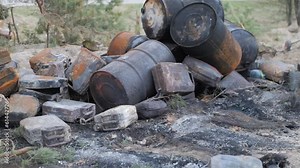 Ukraine war, burnt barrels after exploding