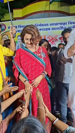 She is TMC MP and actress Rachna Banerjee.She doesn’t seem comfortable shaking hands with the very people she is asking votes from.And standing next to her is TMC candidate Trinankur, who is accused in the recruitment scam.