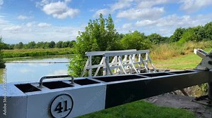 Lovely summer day on the Kennet and Avon Canal in Devizes England, sunny weather with forest trees and green nature, 4K shot