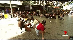 51K views · 248 reactions | A brave young man took a big gamble with a very public marriage proposal. A large crowd stopped to watch a flash mob in Brisbane, including Emi her boyfriend made a surprise appearance and got down on one knee. Thankfully, it was a big yes from the now bride-to-be. www.7NEWS.com.au #7NEWS | 7NEWS Sydney | Facebook