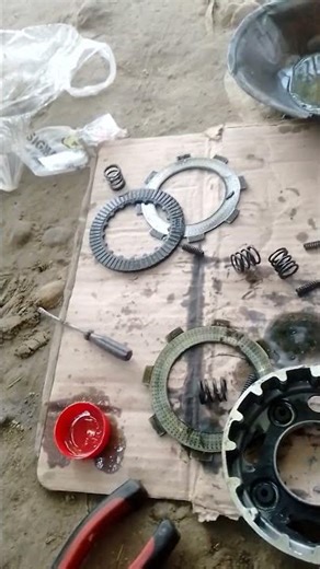 Motorcycle Clutch Plate AssemblyDescription: This image shows the disassembled motorcycle