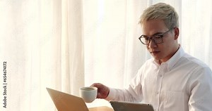 Asian Businessman stress working at home office using computer laptop online meeting. Desperate man stress headache depressed startup small business at home office. Failure businesman work at home