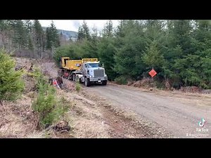 Kenworth c500 hauling a brand new 538 cat log loader