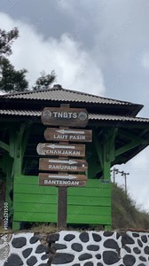 atmosphere of the valley and savanna area of ​​Mount Bromo, signs for the Jemplang route and Bromo Caldera route