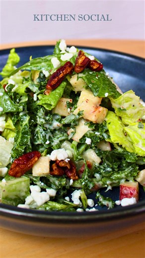 Crisp, fresh, and full of flavor. Our Social House salad features applewood bacon, kale, apples, candied pecans, goat cheese & pear vinaigrette. Add salmon, chicken, or shrimp for the perfect finishing touch. | Kitchen Social