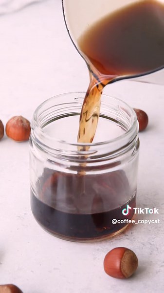 Hazelnut syrup is insanely easy to make and one you can make with just 3 ingredients. Welcome to episode 6 of Homemade Coffee Syrups, a series where I’ll be showing you how to make better-than-storebought coffee syrups at home. Making your own syrups saves money and keeps artificial ingredients and preservatives out of your coffee! Hazelnut syrup is made from a combination of water, sugar, and hazelnut extract. I use Olive Nation because of it’s natural flavor and zero bitterness. Find the recip