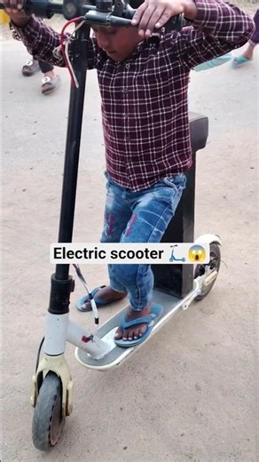 bachha ridding 😘 electric scooter #shortsfeed #electricscooter #publicreactin #ridding