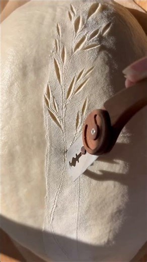 Scoring sourdough with the Wire Monkey Goose bread lame.