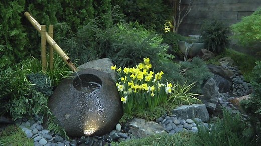 See how a fountain rock and backyard waterfall fit into a small canvas of yard, as featured at the Chicago Flower and Garden Show! | Aquascape Inc.