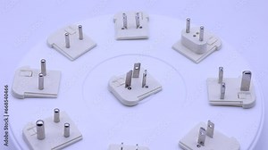 A collection of electrical socket adapters for different countries.