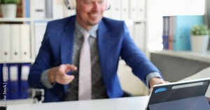 Businessman putting on headphones in front of digital tablet and starting dancing in office 4k movie slow motion. Successful business strategy concept Stock Video
