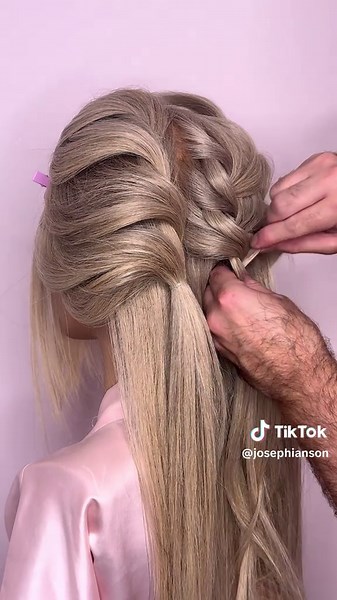 This glossy low bun is pure bridal perfection—clean lines, defined detail and dimensional texture that shows off every twist and curve 🤍 #hairtutorial #hairstyle #hair #lowbun #hairstyles