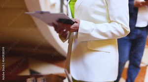 Process of checking in on a conference congress forum event, registration desk table, visitors and attendees receiving a name badge and entrance wristband bracelet and register electronic ticket