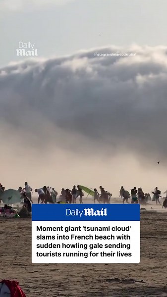 Moment freak wall of cloud slams into French beach with howling gale