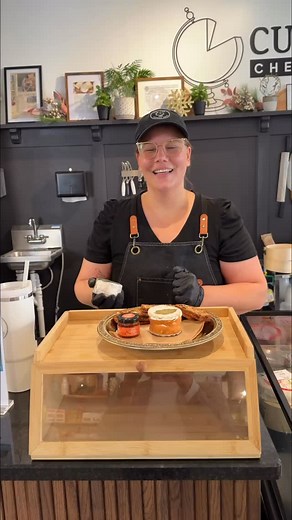 Today we’re sampling @pointreyescheese Quinta in the shop. Wrapped in cedar bark and topped with a Bay leaf - this cows milk bloomy rind cheese is so fragrant and smooth. Just look at that stretch! Trying with @rusticbakery Artisan Crisps and @eatdivina chili orange spread. This is a bite worth making a trip for 😉 | Culture Cheese Shop