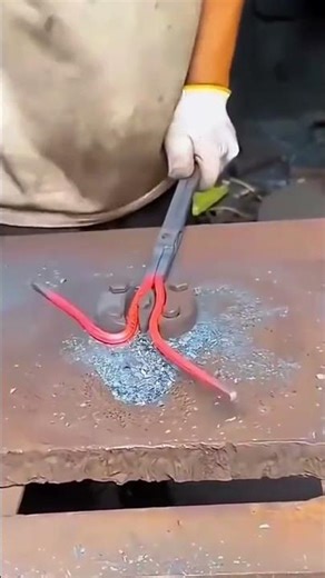 the process of forming scissors from iron by hitting them manually using a hammer