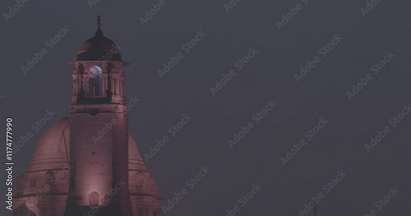 New Delhi, Delhi, India. Close up of Rashtrapati Bhavan, Bell tower in Kartavya Path, Rajpath Area. Rashtrapati Bhavan in evening night illumination lights lighting. Popular Public Space For Tourists