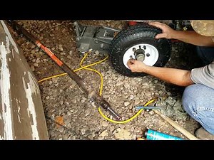 log splitter replacing wheels on a log splitter
