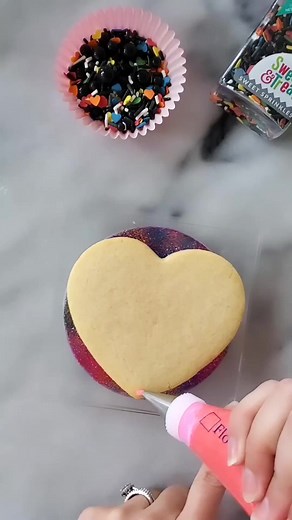 Loving this black and red broken heart cookie! @nataliemariebakes topped these cookies with our Heart Breaker Sprinkles, which is perfectly fitting, don't you think 💔?! #shopsweetsandtreats #valentinesdaycookies #sprinkles #valentinesdaydessert #valentinesdaytreats HEART BREAKER SPRINKLES: https://www.shopsweetsandtreats.com/sprinkles-mix-heart-breaker | Sweets & Treats Boutique