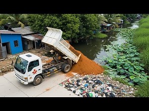 Dump Truck Filling Canal Edge with Soil | Road & Waterway Repair at Water