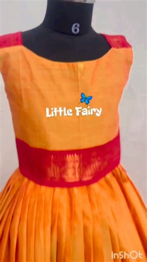 Little Fairy🦋 on Instagram: "• Style: A traditional Indian Dhavani or Lehenga Choli set, featuring a long, pleated skirt and a matching sleeveless blouse. • Color Palette: The primary fabric is a rich mustard yellow/gold with a textured, silk-like finish. • Border Design: Both the blouse and the skirt feature a wide maroon/burgundy border accented with traditional golden zari patterns and a thin strip of royal blue. • Skirt Details: The skirt is heavily pleated, creating a voluminous flare, and