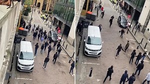 Shocking moment football hooligans unleash chaos in massive street brawl