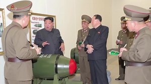 North Korea unveils new nuclear warheads as US air carrier arrives in South