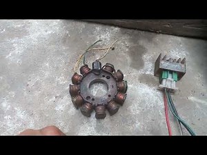 What is the difference between an AC/DC CDI ignition system and how does it work?