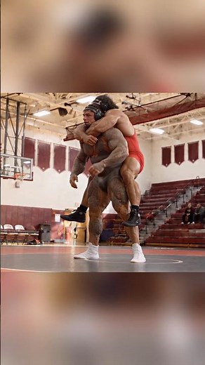Michael DiMatto stands straight up from the bottom position with Kostas Georgios still on his back