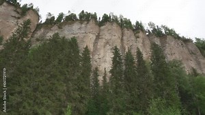 Panning movement from left to right of Vetlan stone, rock on the bank of the Vishera river