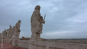 Big statues n the rooftop of Saint Peters Basilica in Rome