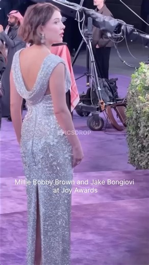 Trendoz on Instagram: "Millie Bobby Brown and Jake Bongiovi at Joy Awards #milliebobby She nailed it 🔥 Millie Bobby Brown gained viral fame for her impressive rapping of Nicki Minaj's verse from the Kanye West song "Monster," showcasing her hidden talent on The Tonight Show Starring Jimmy Fallon in 2016. She performed it multiple times, including at Salt Lake Comic Con that year and in a Stranger Things Season 1 recap rap on the same show. In 2025, she reminisced about the moment during another