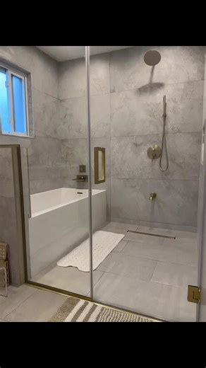 Shower and Tub In one enclosure is a great way to utilize the space. #BathroomRenovation #LuxuryBathroom #fyp