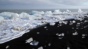 📍Diamond Beach, Iceland The mixture of #Iceland's volcanic ash, basalt sediment, and melted glacial water deposited on Diamond Beach creates a layer of distinctive black sand 🖤 #blacksand #nature | Discovery