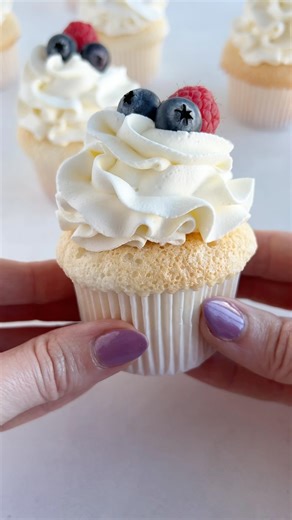 New recipe! Angel food cupcakes with whipped cream frosting! Light and airy, fluffy as can be, send me these cupcakes...right now! Recipe on cakemehometonight.com! #angelfoodcake #angelfoodcupcakes #cupcakes | Cake Me Home Tonight
