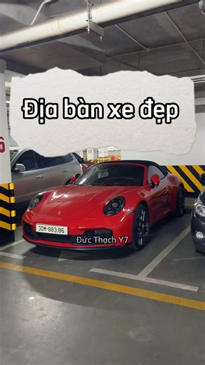 Lost in the world of beautiful cars, captivated by the red Porsche 911 Cabriolet (992.1) and the ...