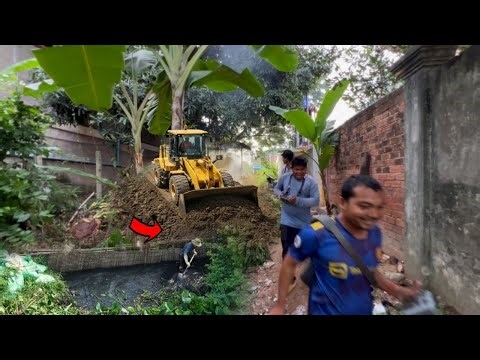+Road Construction Bulldozer on the Brink Clearing the road and pouring soil for the road Push House