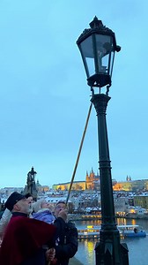 Lamp-lighter on the Charles Bridge ❤️✨Amazing Christmas tradition in PragueDuring Advent you may see an uniformed man who lights up the historical gas lamps. He starts his way from the Old Town Bridge Tower and continues to the Lesser Town direction and returns back.Since 2010 gas lamps were returned to the Charles Bridge, which is the only gas lit bridge in the world ✨📌 Till 23 December⏰ At approx. 16:00 the lamp-lighter will begin to light the historical gaslighting near the Old Town Bridge T