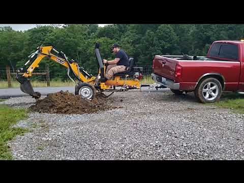 Adding a culvert pipe to the driveway digging it put with my towable backhoe trencher from betstco
