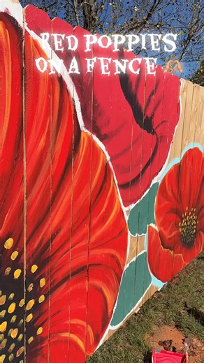 More progress on the Beautiful Red Poppies fence commission. What a beautiful weekend to paint outside. 🫶🏼🥰 #painting #enterprisealabama #mural #muralartist #flowers #poppies | Eye Catchers Artworks