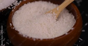 white coconut pulp and dried coconut flakes, a close-up of which is used in the preparation of desserts